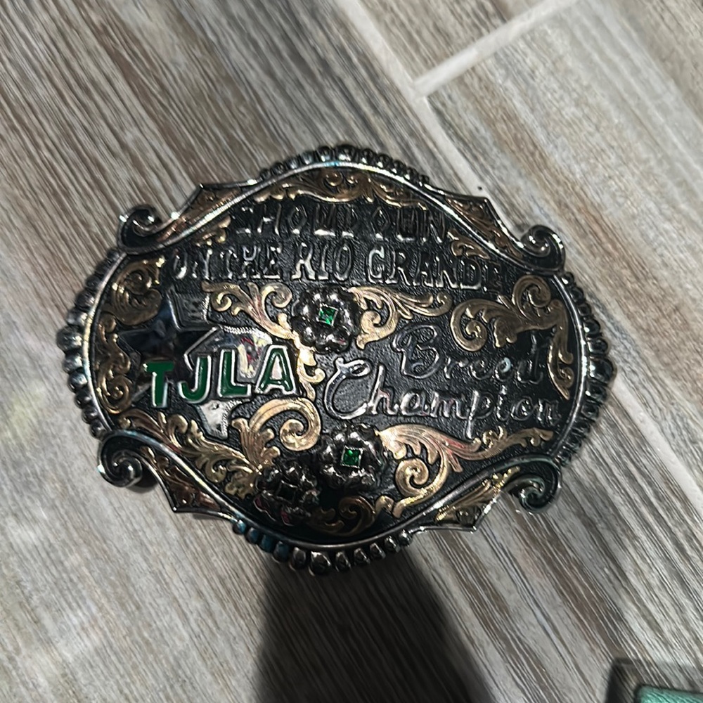Champion cowboy belt buckle
